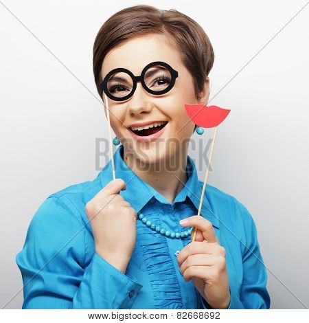 Attractive playful young woman ready for party - falce lips and glasses   