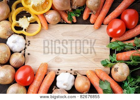 Vegetables and wooden cutting board