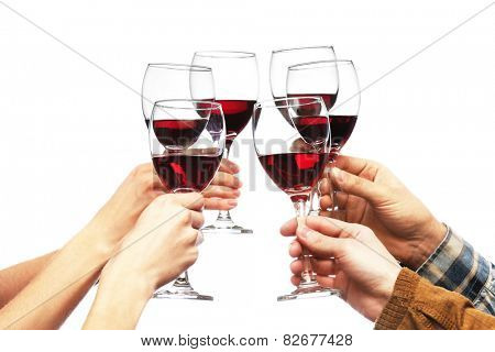 Clinking glasses of red wine in hands isolated on white