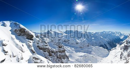 Beautiful view from the Swiss mountain Titlis towards the South. On the horizon from left to right you can see the mountains Sustenhorn, Dammastock, Tierberge and Diechterhorn.