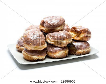 Polish donuts on plate shot on white                               