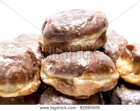Pile of Polish donuts on white  background