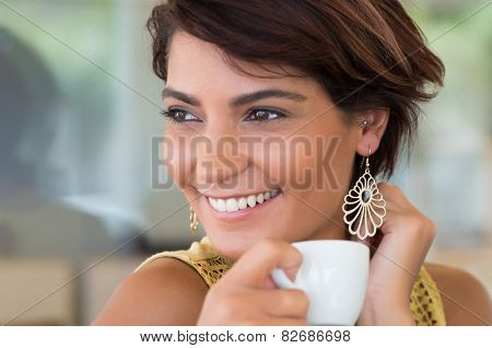 Close Up Of Young Happy Woman Holding Cup Of Coffee At Coffeshop 