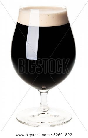 Full beer tulip glass of stout or porter isolated on white background