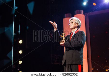 BERLIN, GERMANY - FEBRUARY 12: Wim Wenders receives the Honorary Golden Bear for his lifetime achievement. 65th Berlin  Film Festival at Berlinale Palace on February 12, 2015 in Berlin, Germany