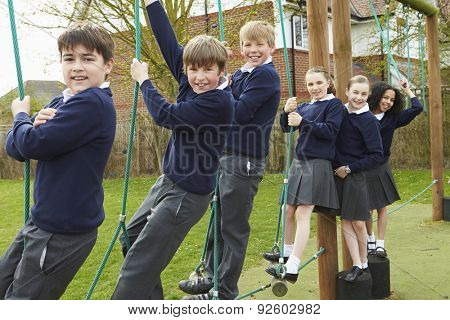 Portrait Of Elementary School Pupils On Climbing Equipment