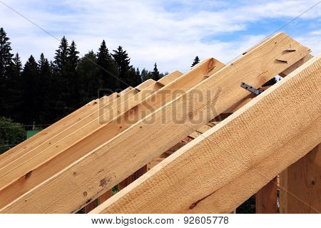 Installation Of Wooden Beams At Construction Of The Frame House