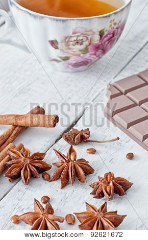 Cinnamon Stick, Star Anise, Bar Of Chocolate And Cup Of Tea