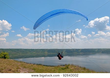 Paraglider Above Bakota Beautiful Reservoir In The Clouds