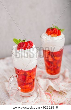 Strawberries In Jelly Topped With Whipped Cream