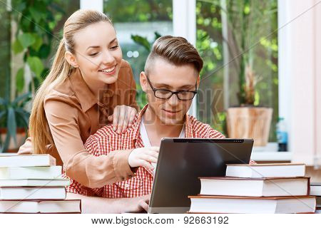 Couple of students in a library