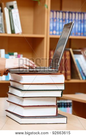 Woman hands in a library