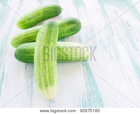 Cucumbers On The Wooden Background