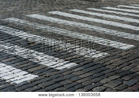 pedestrian crossing on the old rock road in city.