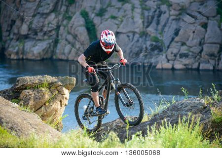 Professional Cyclist Riding the Bike on the Beautiful Spring Mountain Trail. Extreme Sports