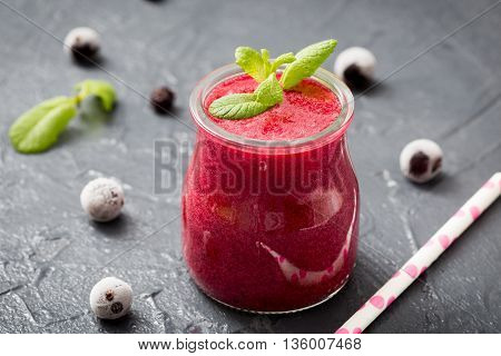 red smoothie with frozen berries selective focus top view. the detox concept.