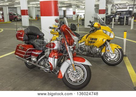 HOUSTON USA - APR 14: Harley Davidson and Honda Goldwing motorcycles in a parking garage. April 14 2016 in Houston Texas United States