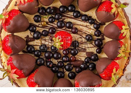 Delicious cheesecake with berries on table close up. White wooden background. Tasty dietary pastries. Natural product. Light dessert. Top view. From above.