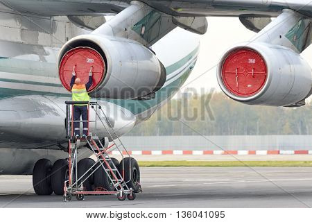 Service Engineer Serves A Jet Engine