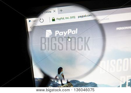 Ostersund, Sweden - June 27, 2016: Paypal  website on under a magnifying glass. PayPal is an international e-commerce business allowing payments and money transfers.