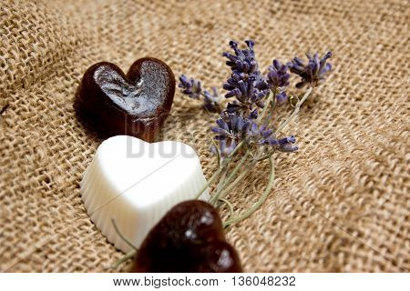 Set Of Heart Soaps And Lavender Twigs On Jute Underlay