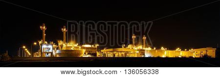 Gas turbine electrical power plant at night with light