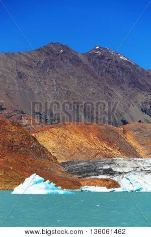  The lake is surrounded by mountains.  Excursion by boat to the huge blue-white iceberg. Unique lake Viedma in Argentine Patagonia. 