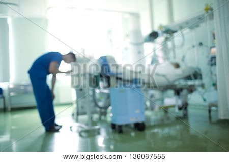 Work with equipment in patient room unfocused background.