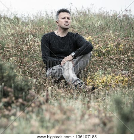 Handsome man. Outdoor male portrait. Image toned.