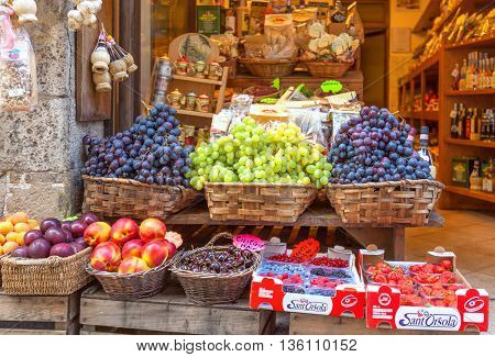 Montepulciano Italy - August 18 2013: Street shop with different fresh and juicy fruit.