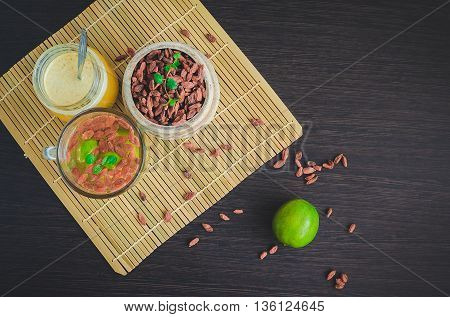 Fresh antioxidant herbal tea from goji berries lime and honey in a glass cup. Wolfberry for a healthy diet. Healthy food. Alternative medicine. Recovery. Rejuvenation. Slimming. Mystic light style.