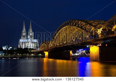 Cologne, North Rhine-Westphalia, Germany - June 11, 2016: View of Cologne Cathedral and Hohenzollern Bridge.