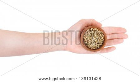 Hand holding wooden bowl with dried utsho suneli isolated on white