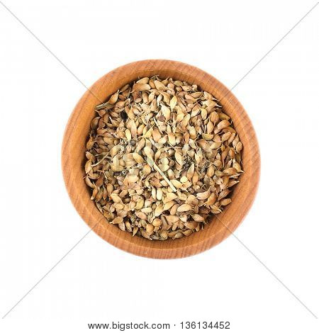 Dried utsho suneli in small wooden bowl isolated on white