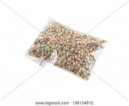 Dried utsho suneli in plastic zipper bag, isolated on white