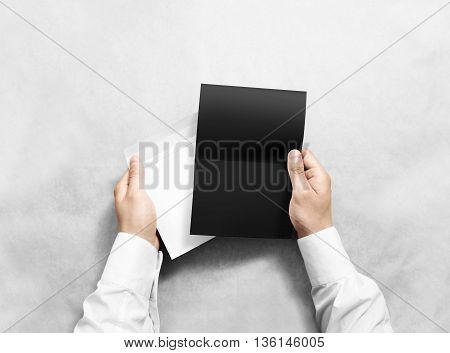 Hand holding blank envelope and black letter mockup, isolated. Arm hold grey brochure template mock up. Greeting card leaflet surface design. Invitation print display show. Reading writing envelope.