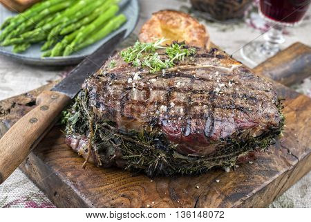 Barbecue T-Bone Steak with Green Asparagus and Yorkshires