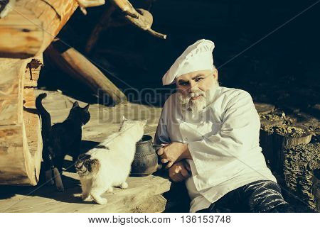 Bearded Cook With Kettle And Cats