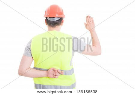 Young Constructor Taking Oath With Crossed Fingers Behind His Back