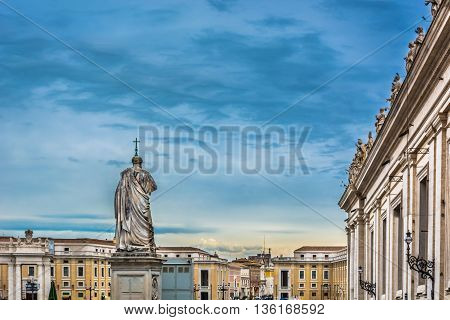 Main catholic square in Vatican city with sculptures of saints, evening time.