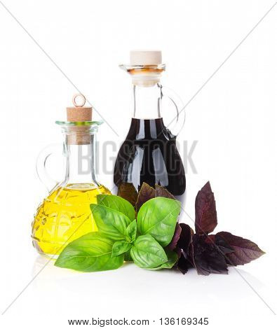 Fresh garden basil, vinegar and olive oil. Isolated on white background