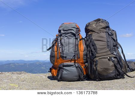 Camping with backpacks in the mountains with views of the mounta