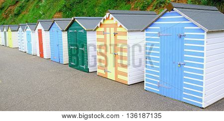 Row of colorful beach huts in Seaton Devon