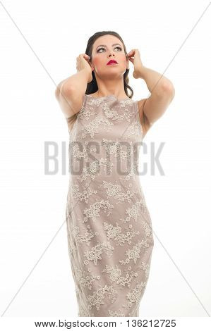 fashion model posing in studio, she wear evening dress