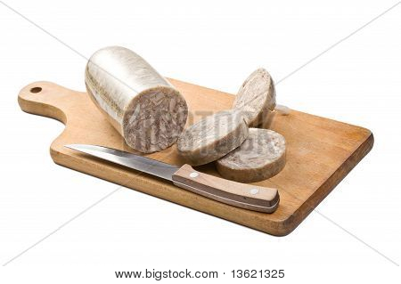 Headcheese salsiccia sulla tavola di legno
