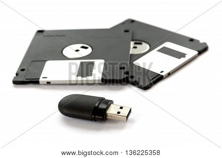 Two Black Floppy Disks And A Flash Drive