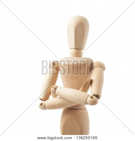 Made of wood human doll puppet statuette with its hands crossed, composition isolated over the white background