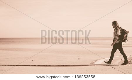 Man Hiker With Backpack Tramping By Seaside