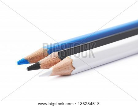 Three drawing pencils composition isolated over the white background, close-up crop fragment