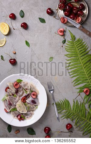 Cooked cherry dumplings, made with wonton wrappers and sweet berries. Traditional cuisine. Top view.